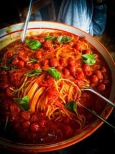 Italian pasta with tomato sauce and fresh basil, culinary travel
