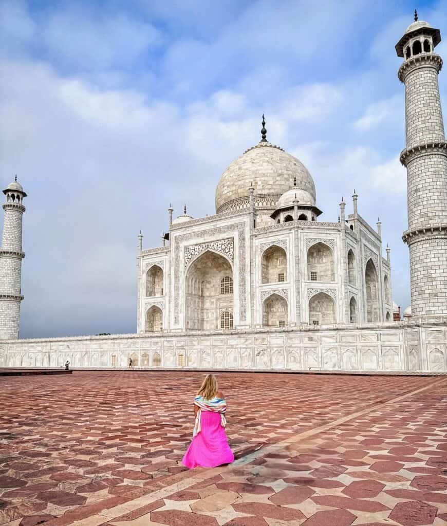 Charity in a pink skirt walking toward the Taj Mahal in Agra, India