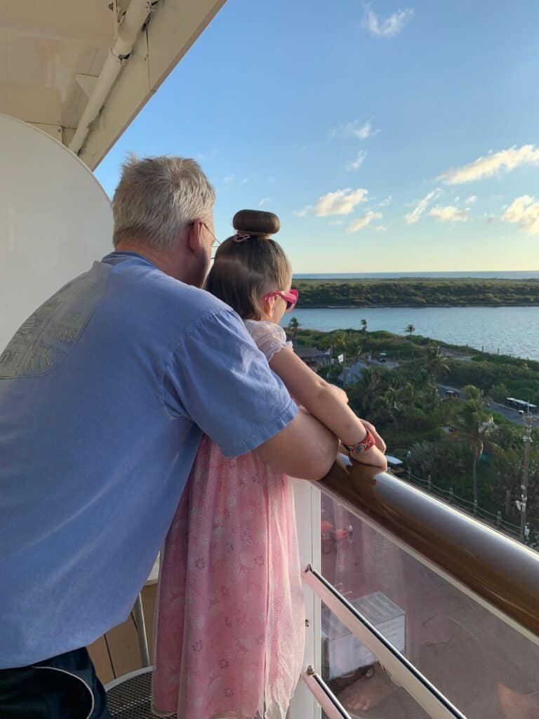 Husband and Charlie at the rail over Castaway Cay